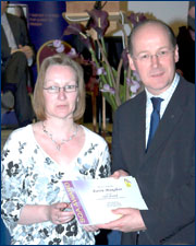 PHOTO: Karen Maughan receiving the award from John Swinney MSP, Cabinet Secretary for Finance and Sustainable Growth