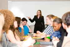 woman talking to room of people