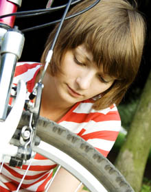 Girl repairing bike