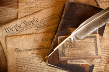 quill lying on top of historical documents