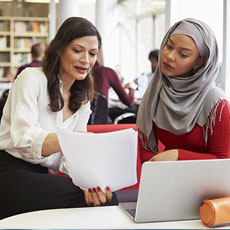 Students looking at papers
