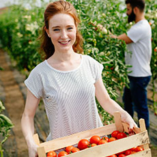 Agriculture student holding plants 