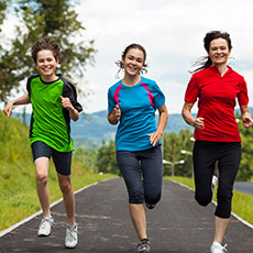 Photo of three young people running